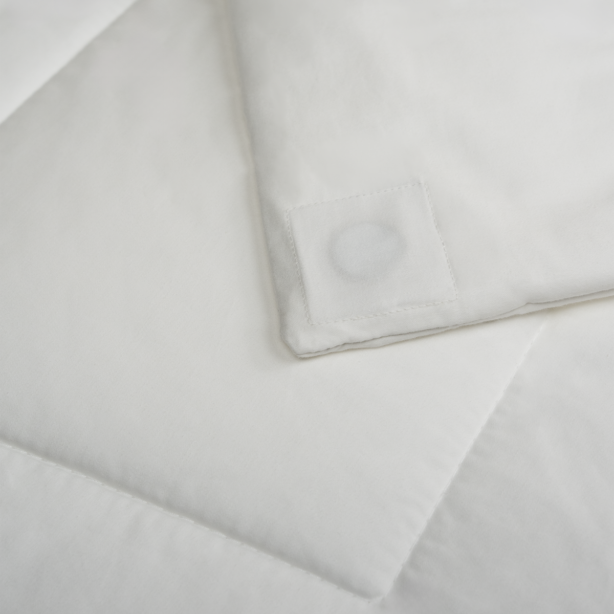 Corner of the duvet insert showing the sewn-in magnet patch