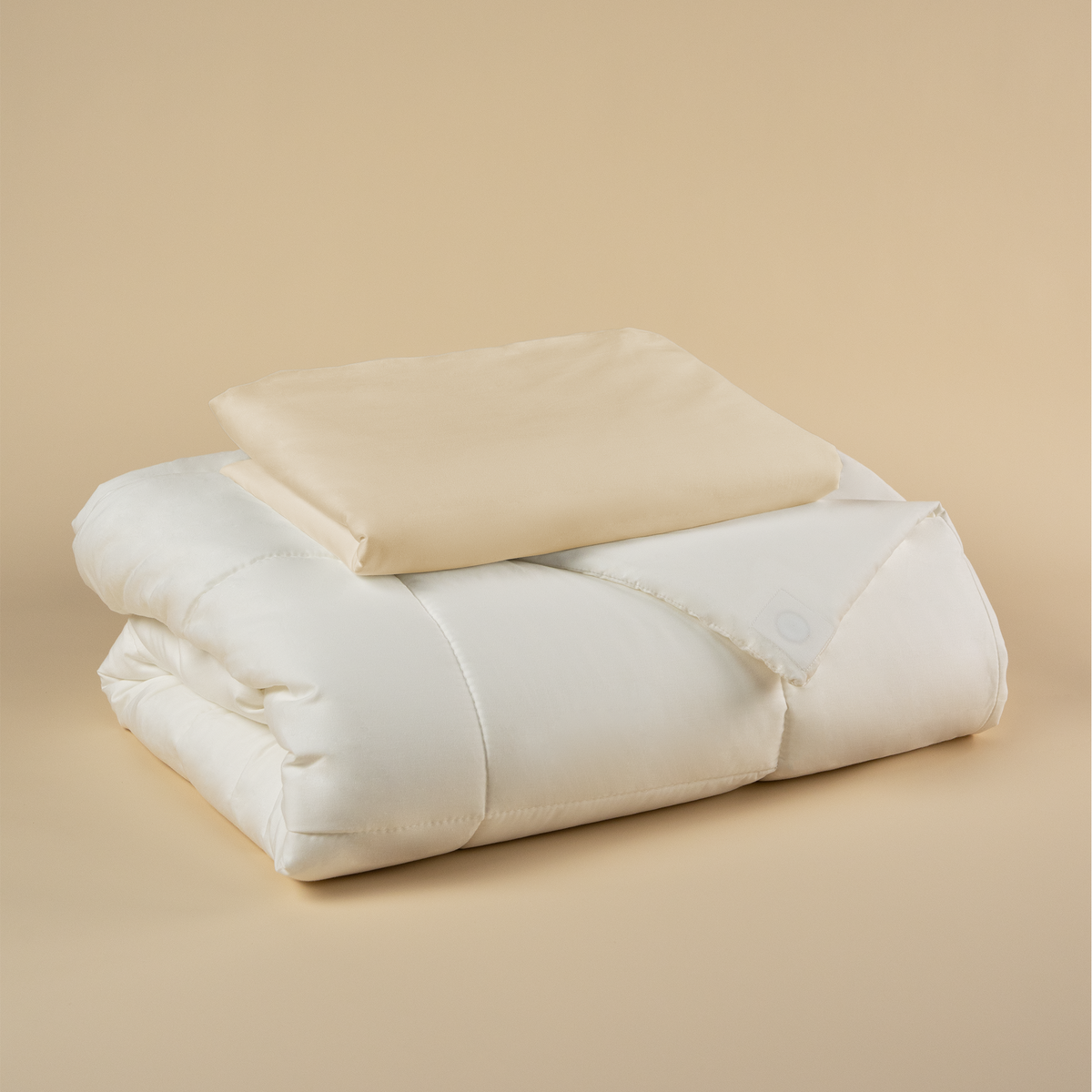 Tureis Magnetic Duvet System Set with the Dune Sand cover folded on top of the duvet insert