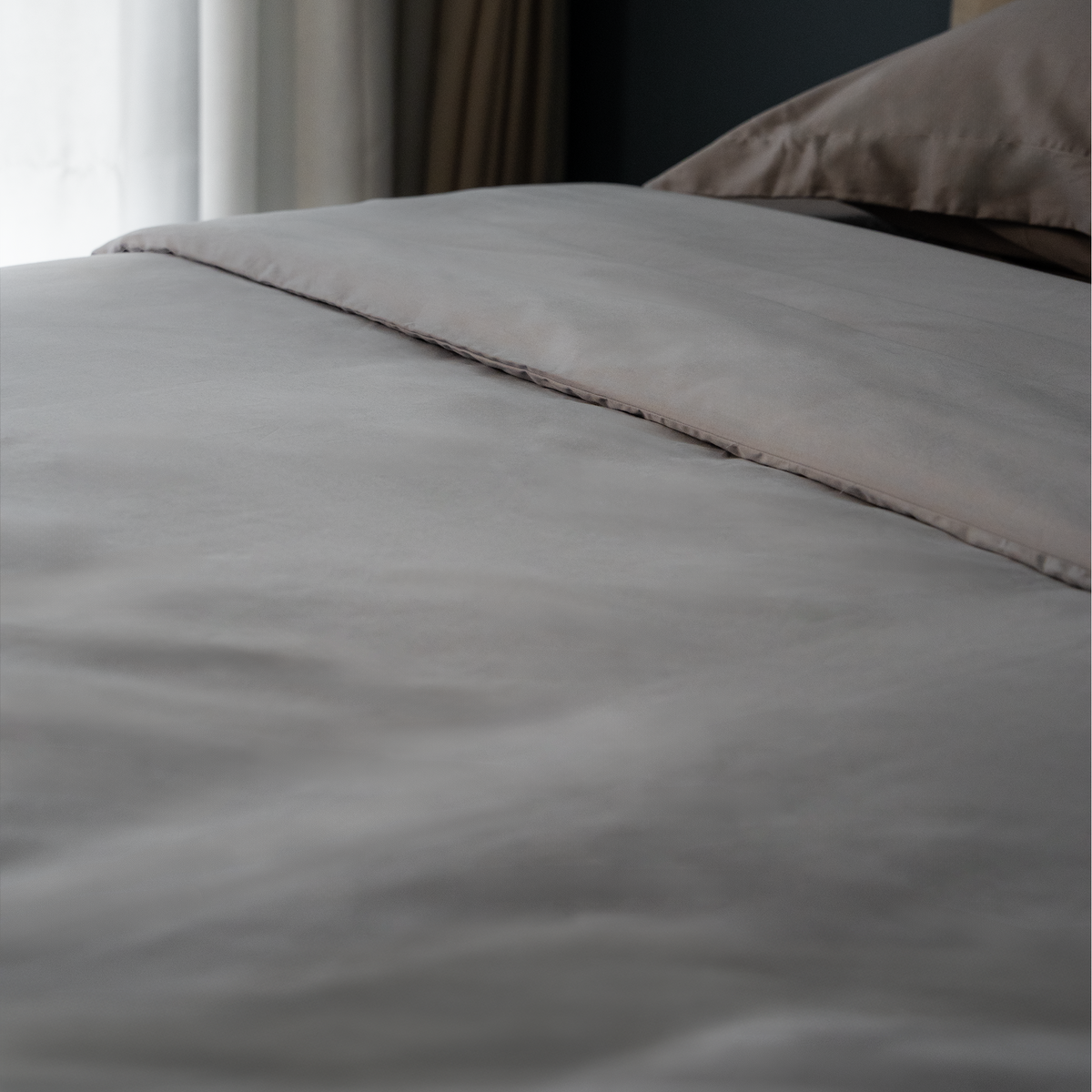 Quiet Grey duvet cover on a made bed