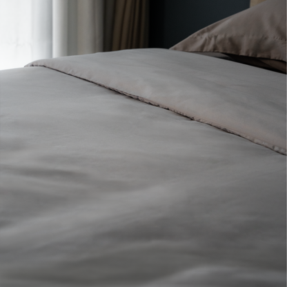 Quiet Grey duvet cover on a made bed